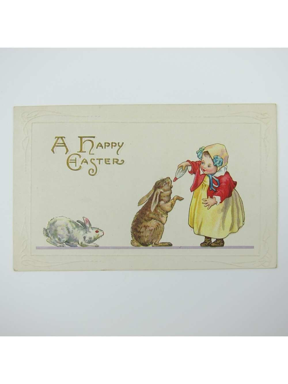 Easter Postcard Girl Yellow Dress & Bonnet Feeds Bunny Rabbits Embossed Antique